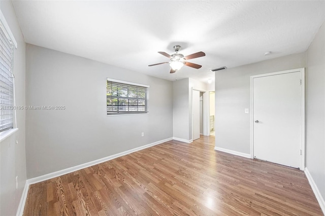 6421 NW 24th Pl, Sunrise, FL 33313 - unfurnished bedroom with a ceiling fan, baseboards, visible vents, and light wood-style floors