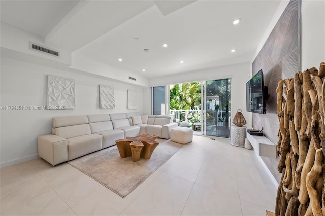 living room featuring baseboards, recessed lighting, light tile patterned flooring, and visible vents