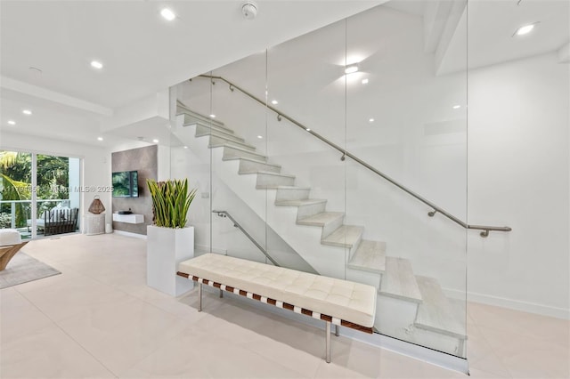 stairway featuring recessed lighting and tile patterned flooring