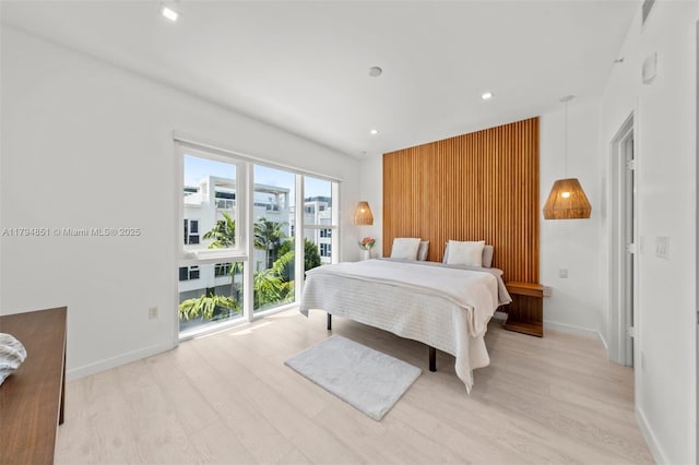 bedroom featuring recessed lighting, baseboards, access to exterior, and light wood finished floors