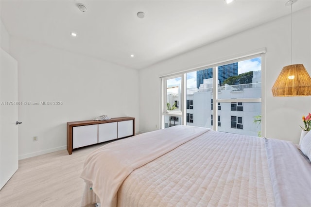 bedroom featuring recessed lighting, baseboards, and light wood-style flooring