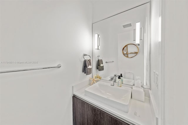 bathroom featuring visible vents and vanity