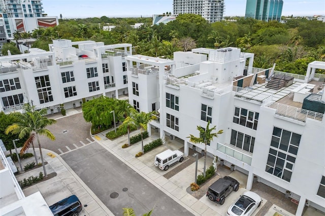 birds eye view of property featuring a city view