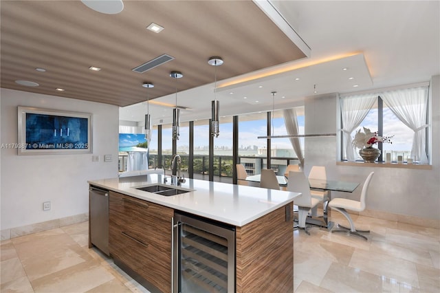 5875 Collins Ave Unit 1908, Miami Beach, FL 33140 - bar with baseboards, plenty of natural light, a sink, and wine cooler