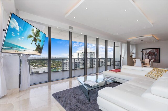5875 Collins Ave Unit 1908, Miami Beach, FL 33140 - living area featuring recessed lighting, marble finish floor, and a wall of windows