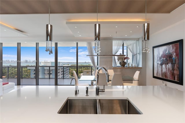 5875 Collins Ave Unit 1908, Miami Beach, FL 33140 - kitchen with a sink, light countertops, and recessed lighting