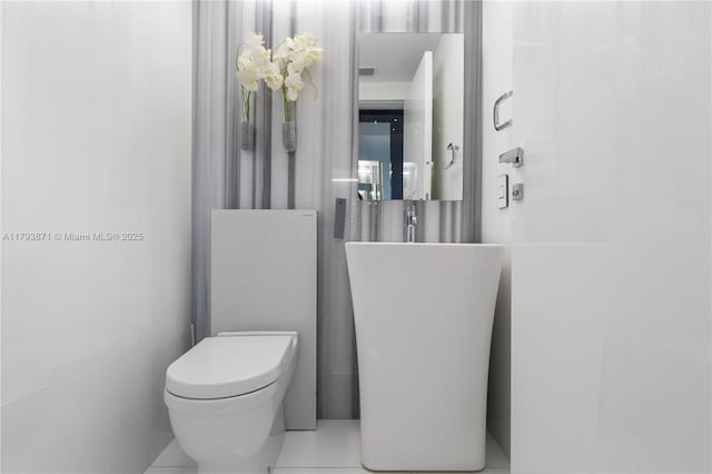 5875 Collins Ave Unit 1908, Miami Beach, FL 33140 - bathroom featuring toilet and visible vents