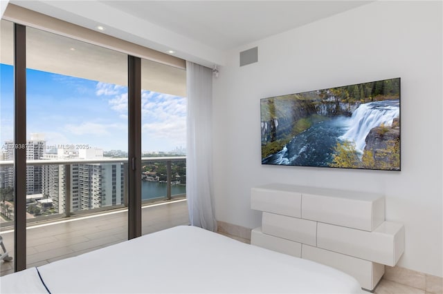 5875 Collins Ave Unit 1908, Miami Beach, FL 33140 - bedroom with expansive windows, recessed lighting, tile patterned flooring, and visible vents