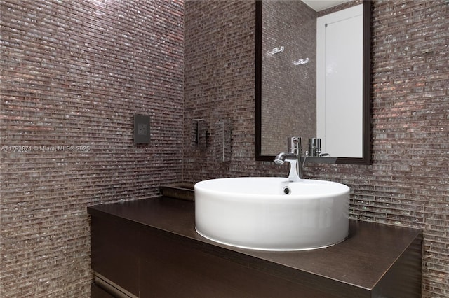 5875 Collins Ave Unit 1908, Miami Beach, FL 33140 - bathroom featuring tile walls and a sink