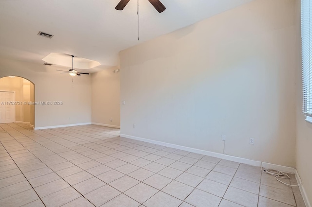 8857 SW 222nd Ter, Cutler Bay, FL 33190 - empty room featuring light tile patterned floors, arched walkways, ceiling fan, and visible vents
