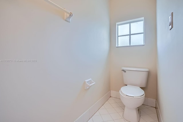 8857 SW 222nd Ter, Cutler Bay, FL 33190 - bathroom featuring toilet, baseboards, and tile patterned floors