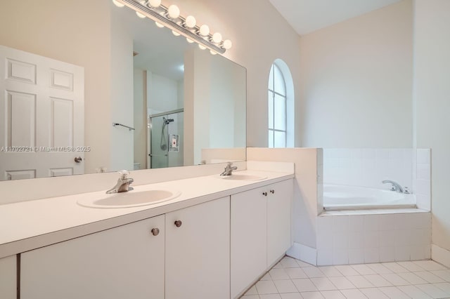 8857 SW 222nd Ter, Cutler Bay, FL 33190 - bathroom with a sink, double vanity, a shower stall, and a bath
