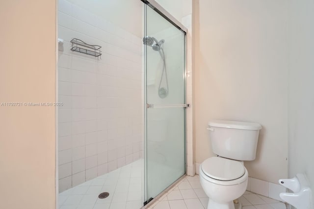 8857 SW 222nd Ter, Cutler Bay, FL 33190 - full bath with baseboards, tile patterned floors, a stall shower, and toilet