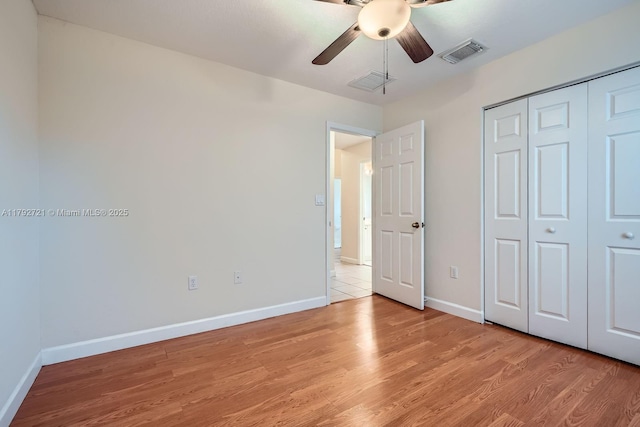 8857 SW 222nd Ter, Cutler Bay, FL 33190 - unfurnished bedroom featuring baseboards, a closet, light wood-style flooring, and visible vents