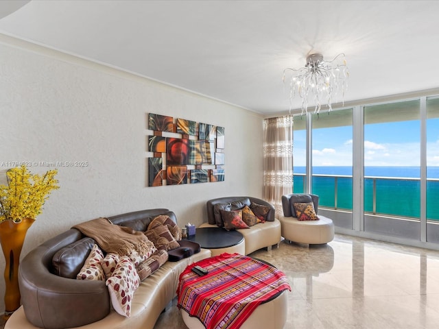 living room with a water view and a chandelier