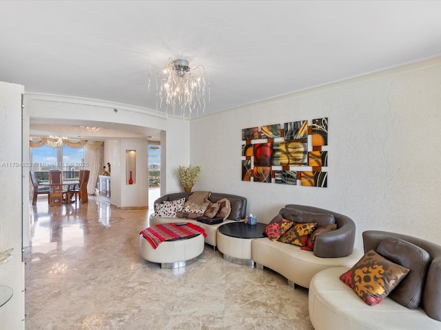 living area featuring an inviting chandelier