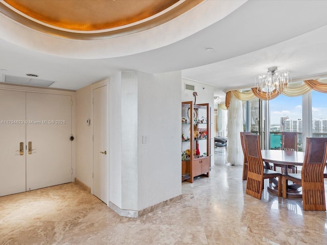 interior space with visible vents and a chandelier