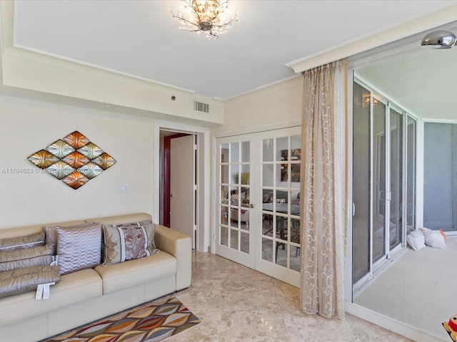 living area featuring crown molding, visible vents, and french doors