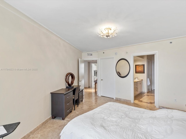 bedroom with connected bathroom, baseboards, and ornamental molding
