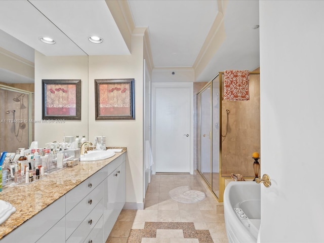 full bath featuring a garden tub, double vanity, ornamental molding, a shower stall, and a sink