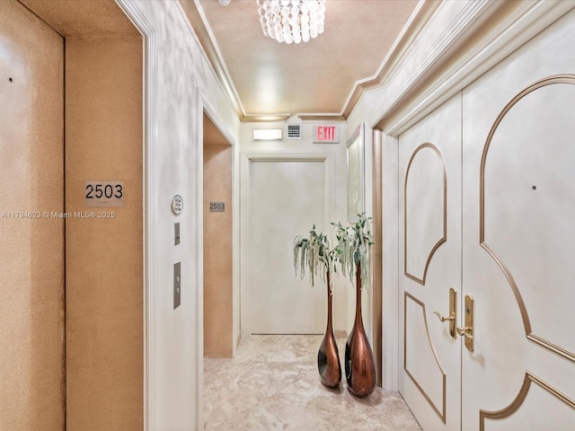 hall with crown molding and elevator