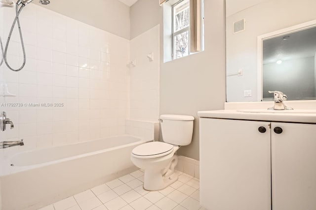 bathroom featuring visible vents, vanity, toilet, tile patterned floors, and shower / washtub combination