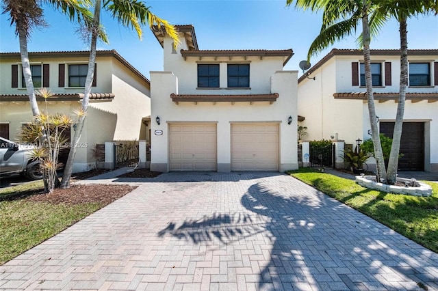 8904 SW 229th St, Cutler Bay, FL 33190 - view of front of house with a garage, decorative driveway, stucco siding, and a tiled roof