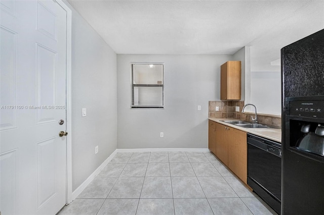 8904 SW 229th St, Cutler Bay, FL 33190 - kitchen featuring brown cabinetry, a sink, black appliances, and light countertops