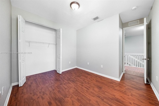 8904 SW 229th St, Cutler Bay, FL 33190 - unfurnished bedroom featuring baseboards, visible vents, wood finished floors, and a closet