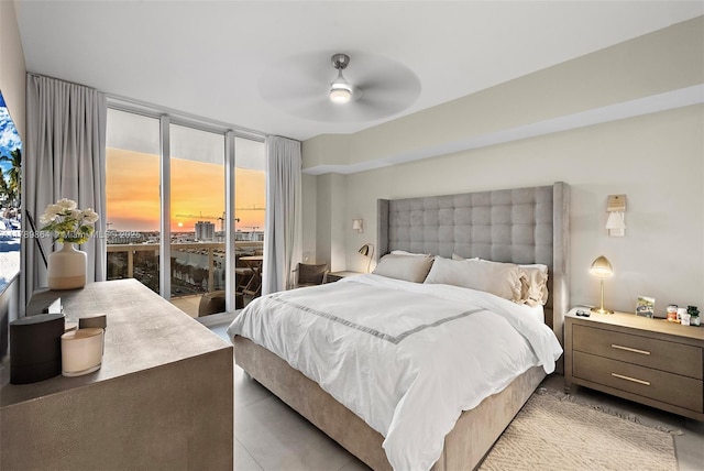 bedroom with a ceiling fan and access to exterior