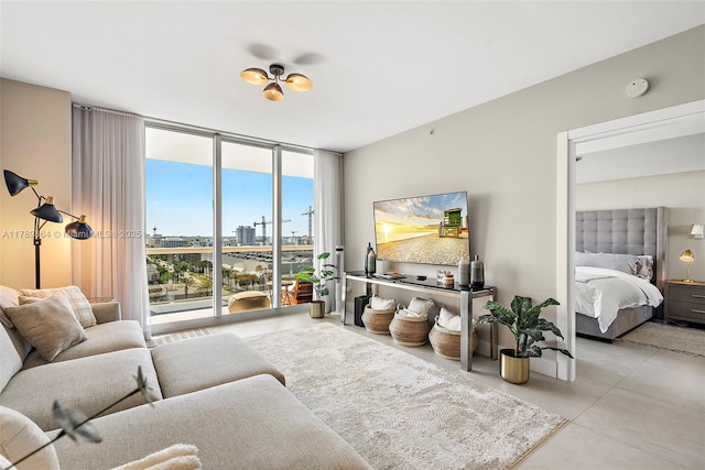 living room with finished concrete flooring and a wall of windows