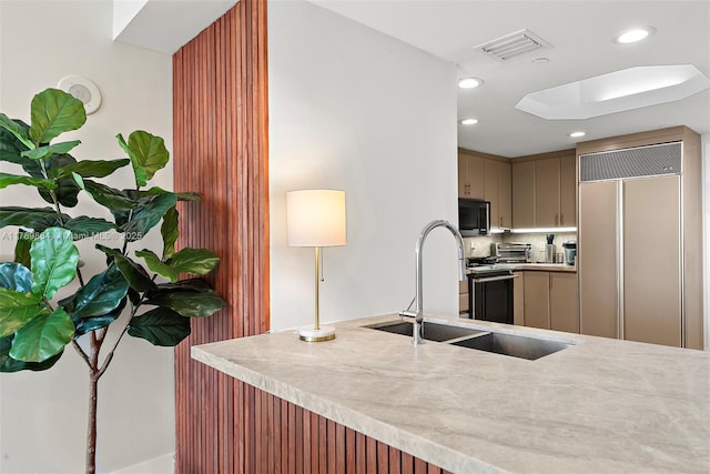 kitchen with visible vents, decorative backsplash, recessed lighting, light countertops, and paneled fridge
