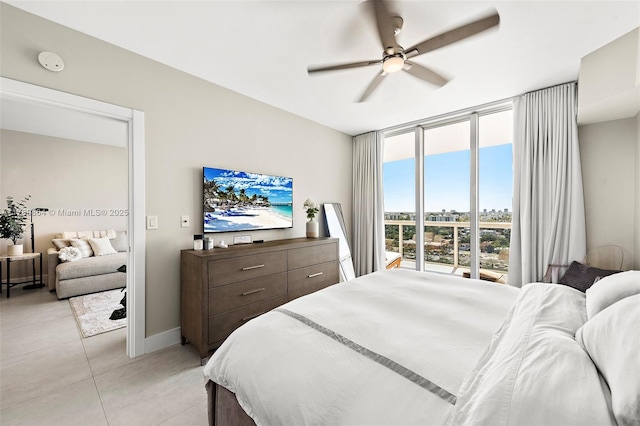 bedroom with a wall of windows, ceiling fan, baseboards, access to outside, and light tile patterned flooring