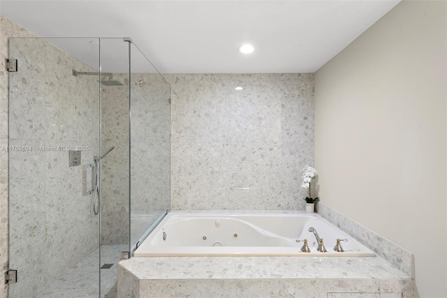 full bath with a jetted tub, a shower stall, and recessed lighting