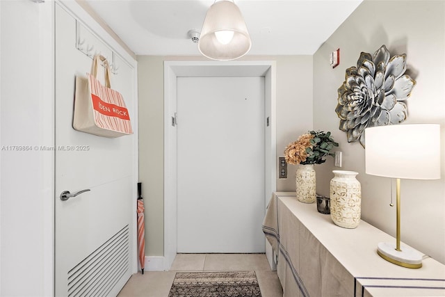 doorway featuring light tile patterned floors