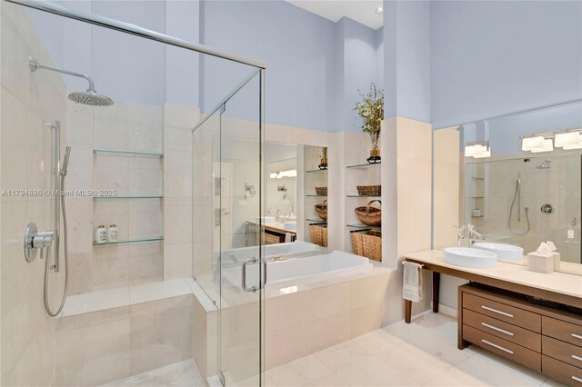 465 Brickell Ave Unit 2801, Miami, FL 33131 - bathroom with vanity, tile patterned flooring, a stall shower, and a garden tub