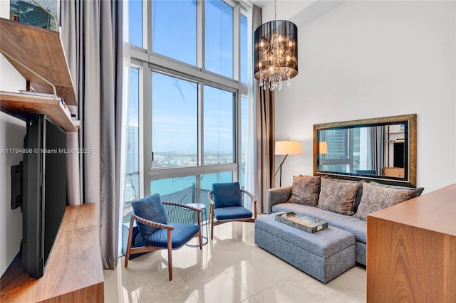 465 Brickell Ave Unit 2801, Miami, FL 33131 - living room featuring an inviting chandelier, a high ceiling, tile patterned flooring, and a healthy amount of sunlight