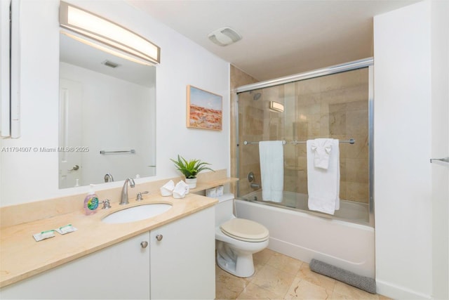 full bathroom with vanity, bath / shower combo with glass door, visible vents, and toilet