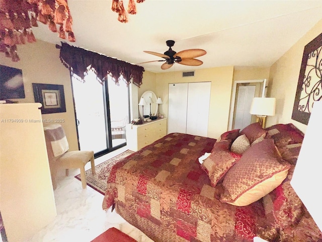 bedroom featuring visible vents, a closet, marble finish floor, access to exterior, and ceiling fan