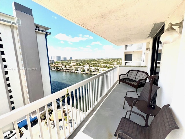 balcony featuring a water view