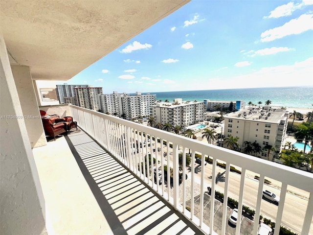 balcony with a city view and a water view