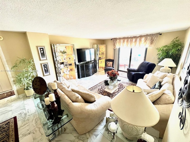 living area featuring a textured ceiling and marble finish floor