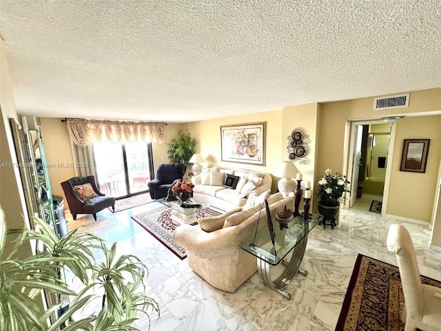 living area featuring visible vents, a textured ceiling, and marble finish floor