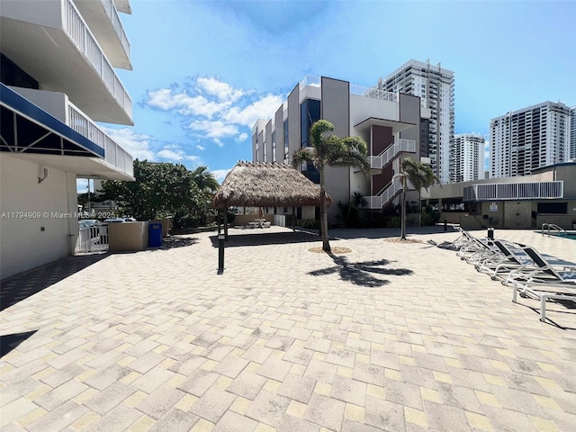 view of patio with a view of city and a gazebo
