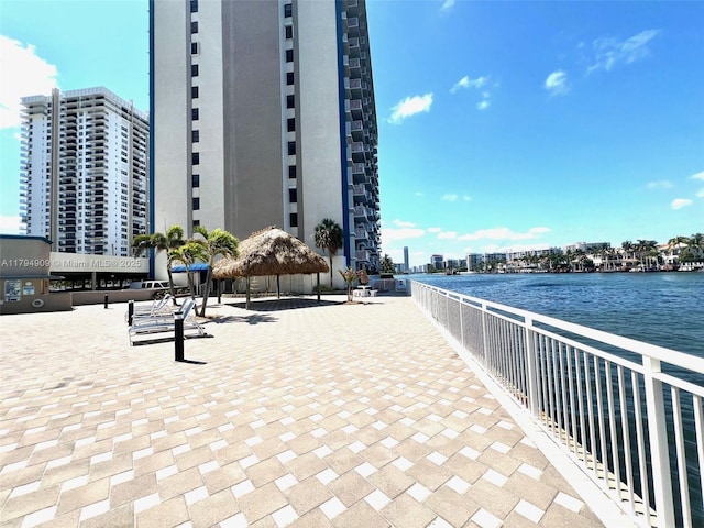 view of property's community featuring a water view and a view of city