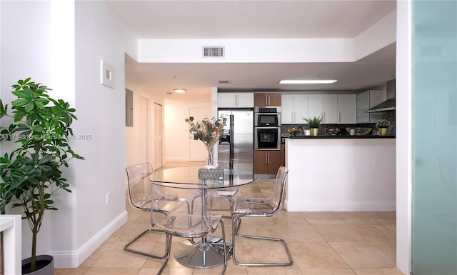 170 SE 14th St Unit 2708, Miami, FL 33131 - dining space featuring visible vents, baseboards, and light tile patterned floors