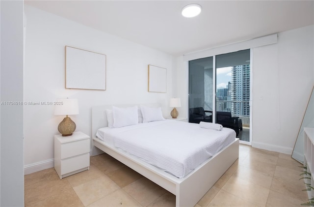 170 SE 14th St Unit 2708, Miami, FL 33131 - bedroom with access to outside, baseboards, light tile patterned flooring, and expansive windows