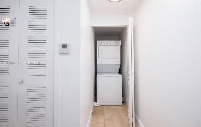 170 SE 14th St Unit 2708, Miami, FL 33131 - laundry area with laundry area, stacked washer and dryer, baseboards, and light tile patterned floors