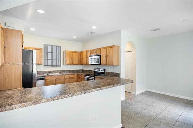 27056 SW 140th Pl, Homestead, FL 33032 - kitchen with stainless steel appliances, a sink, arched walkways, a peninsula, and light tile patterned floors