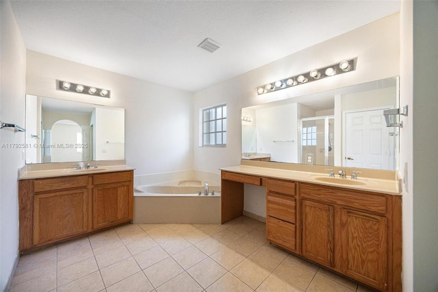 27056 SW 140th Pl, Homestead, FL 33032 - bathroom featuring a stall shower, two vanities, a bath, and tile patterned floors